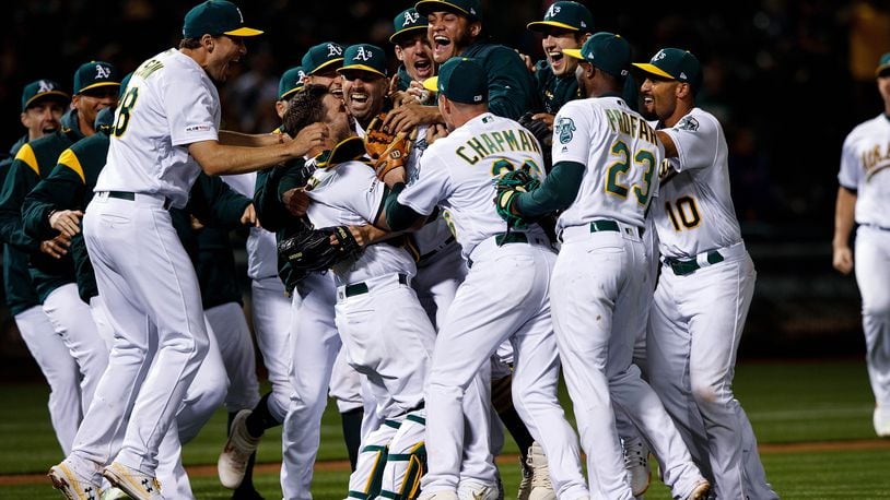 OAKLAND, CA - MAY 07: Mike Fiers #50 of the Oakland Athletics celebrates with teammates after pitching a no hitter against the Cincinnati Reds at the Oakland Coliseum on May 7, 2019 in Oakland, California. The Oakland Athletics defeated the Cincinnati Reds 2-0. (Photo by Jason O. Watson/Getty Images)