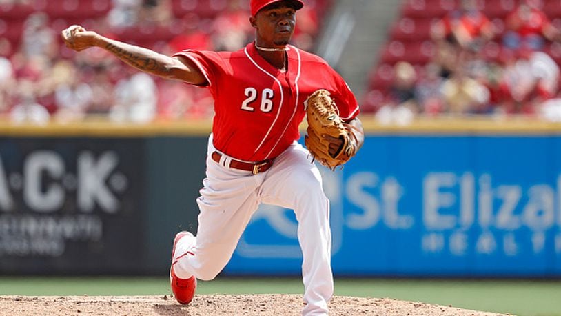 CINCINNATI, OH - AUGUST 04: Raisel Iglesias #26 of the Cincinnati Reds pitches in the seventh inning against the St. Louis Cardinals at Great American Ball Park on August 4, 2016 in Cincinnati, Ohio. The Reds defeated the Cardinals 7-0. (Photo by Joe Robbins/Getty Images)