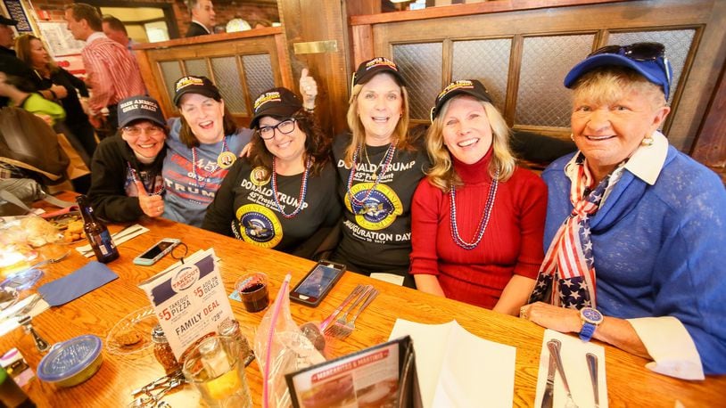 Trump for President campaign volunteers Eileen Barrick, Debbie Seiler, Terry Lewis, Terri Piening, Mary Sue Krummen, and Maureen Sollberger gather during an inauguration celebration Friday night in West Chester Twp. GREG LYNCH / STAFF