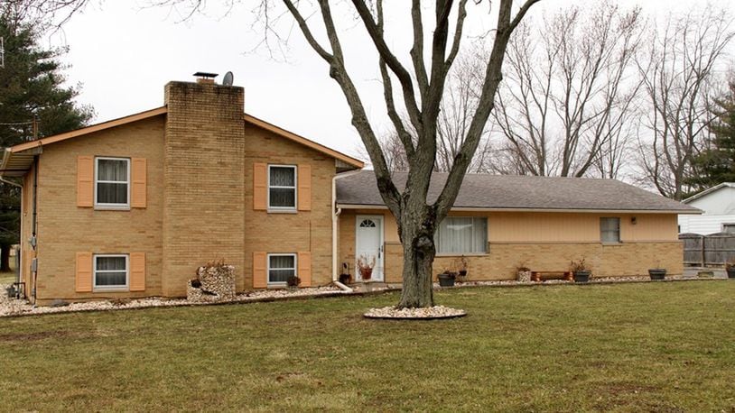 The 3-bedroom house sits on a 1-acre property with a fenced back yard, extra-wide driveway with parking pad and a heated, 2-car attached garage. The lower level has a family room with a brick, wood-burning fireplace. CONTRIBUTED PHOTOS BY KATHY TYLER