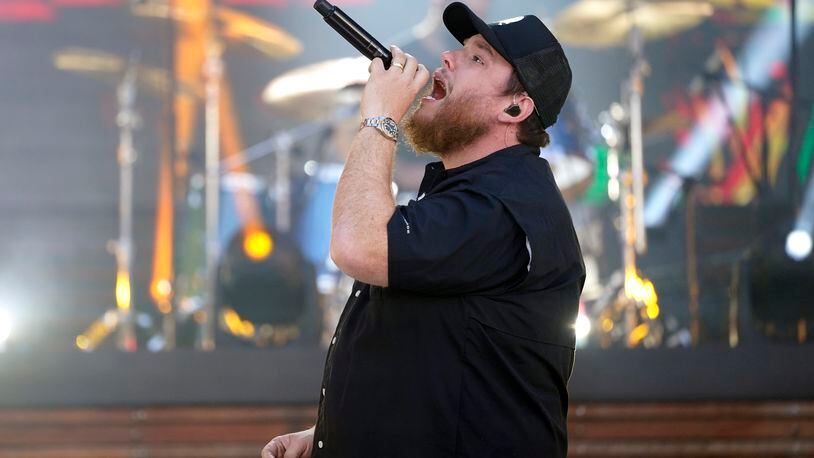 FILE - In this May 13, 2021, file photo, Luke Combs performs at the CMT Music Awards in Nashville, Tenn. Combs is paying the funeral expenses of three young men who saw him perform at a Michigan event before they died from accidental carbon monoxide poisoning at a nearby campground, relatives said. (AP Photo/Mark Humphrey, File)