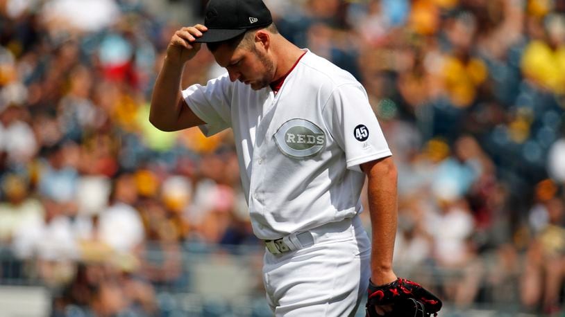 PITTSBURGH, PA - AUGUST 25:  Trevor Bauer #27 of the Cincinnati Reds reacts in the second inning against the Pittsburgh Pirates at PNC Park on August 25, 2019 in Pittsburgh, Pennsylvania. Teams are wearing special color schemed uniforms with players choosing nicknames to display for Players' Weekend. (Photo by Justin K. Aller/Getty Images)