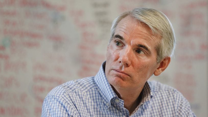 Sen. Rob Portman, R-Ohio, listens during a roundtable discussion with former addiction recovery clients and current employees at the Adams Recovery Center for Women, Wednesday, July 5, 2017, in Cincinnati. (AP Photo/John Minchillo)