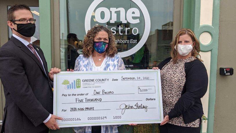 One Bistro accepts a check from the Greene County Community Improvement Corporation. CONTRIBUTED