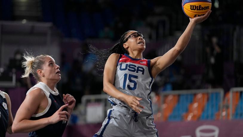 FILE - United States' Allisha Gray (15) heads to the basket past Evgeniia Frolkina (16), of the Russian Olympic Committee, during a women's 3-on-3 gold medal basketball game at the 2020 Summer Olympics, July 28, 2021, in Tokyo, Japan. Gray is glad to be back playing 3x3 with an eye toward being a member of the team at the Paris Olympics this summer. She is the only player returning from the foursome that took home the gold at the Tokyo Games three years ago. (AP Photo/Jeff Roberson, File)