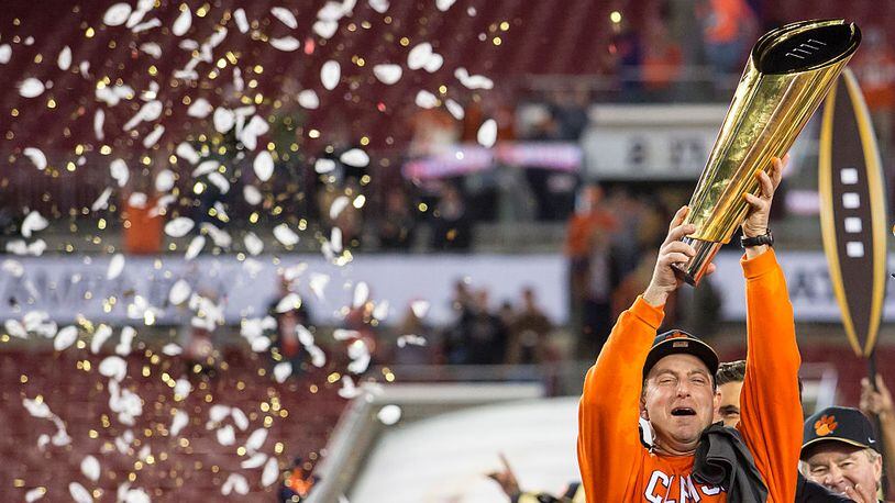 Clemson coach Dabo Swinney hoisted the national championship trophy when the Tigers defeated Alabama in Tampa, Fla. Will Swinney hold the title airborne again on Jan. 8 in Atlanta?