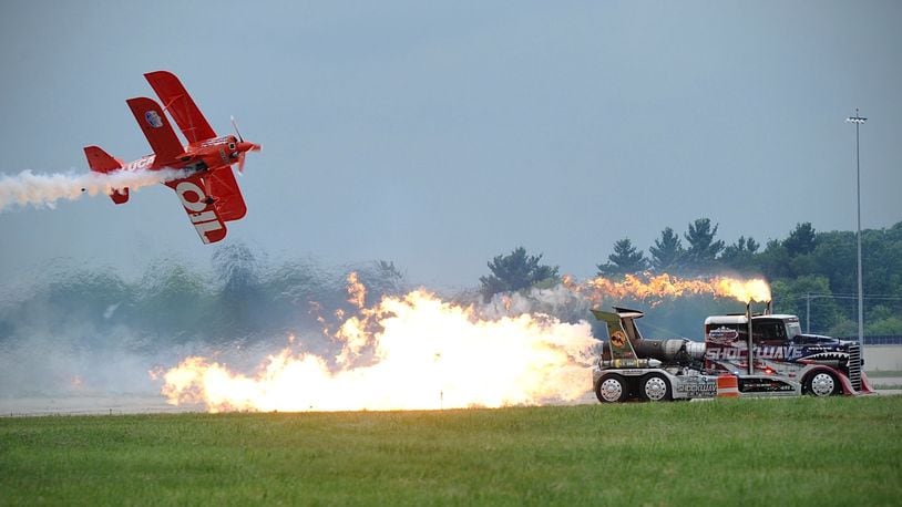 Shockwave, the world’s fastest truck with three jet engines, races the Lucas Oil biplane at the Center Point Energy Dayton Air Show. Saturday, July 10, 2021. MARSHALL GORBY\STAFF