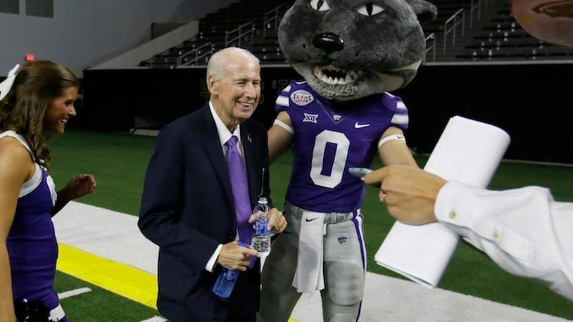 Kansas State head football coach Bill Snyder smiles beside team mascot Willie the Wildcat after speaking to reporters during the Big 12 NCAA college football media day in Frisco, Texas, Tuesday, July 18, 2017. (AP Photo/LM Otero)