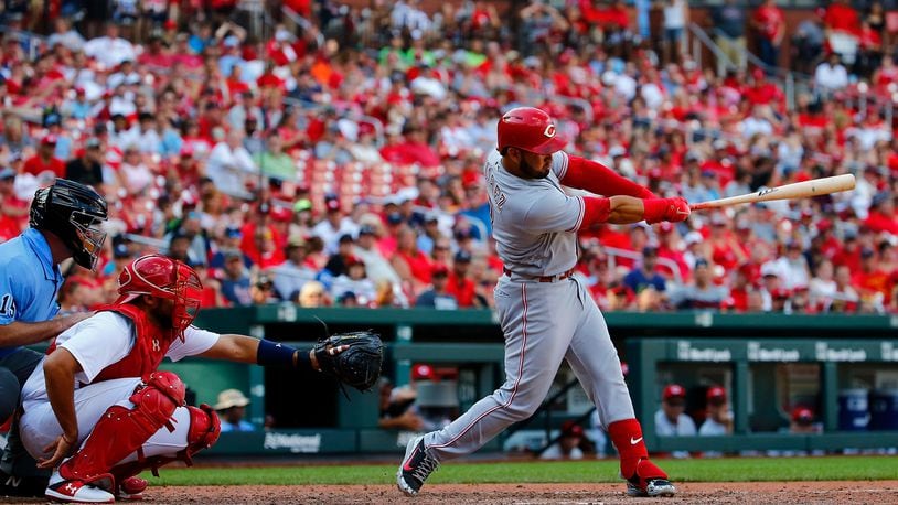 ST. LOUIS, MO - SEPTEMBER 2: Eugenio Suarez #7 of the Cincinnati Reds hits the game-winning two-run home run against the St. Louis Cardinals in the tenth inning at Busch Stadium on September 2, 2018 in St. Louis, Missouri.  (Photo by Dilip Vishwanat/Getty Images)