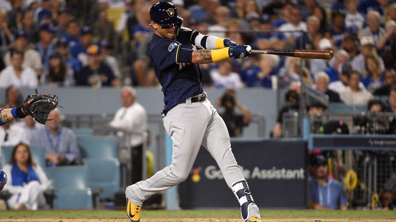 LOS ANGELES, CA - OCTOBER 15:  Orlando Arcia #3 of the Milwaukee Brewers hits a two-run home run over the right field wall during the seventh inning of Game Three of the National League Championship Series against the Los Angeles Dodgers at Dodger Stadium on October 15, 2018 in Los Angeles, California.  (Photo by Kevork Djansezian/Getty Images)