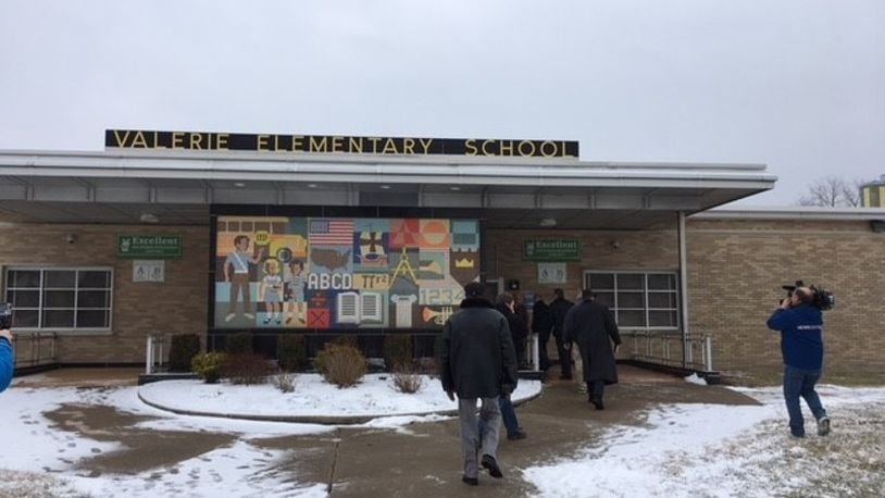 Members of a combined city-Dayton Public Schools task force studying school facilities tour Valerie Elementary School on Tuesday, Feb. 6. The tours ended before scheduled because of a legal challenge. SEAN CUDAHY/Staff