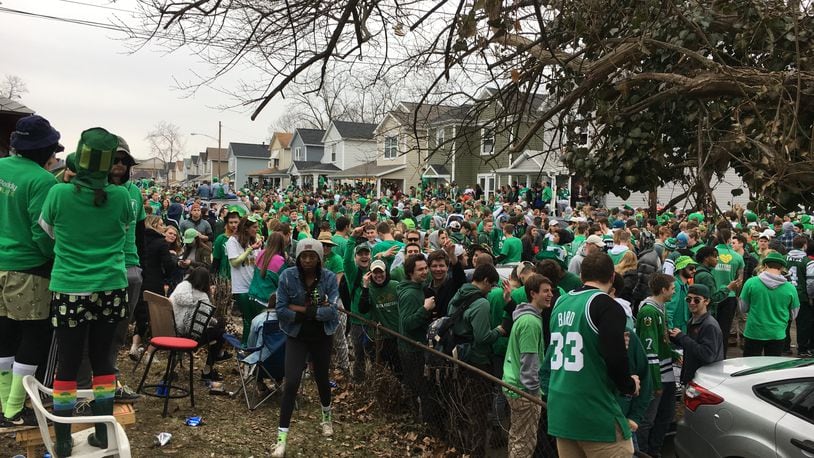 Police in riot gear dispersed a large crowd that gathered on Lowes Street in Dayton during St. Patrick’s Day celebrations Saturday March 17, 2018. Steve Maguire/Staff