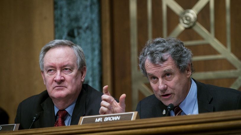 WASHINGTON, DC - JANUARY 30: Commitee Chairman Mike Crapo (R-ID) looks on as Ranking Member Sherrod Brown (D-OH) questions Treasury Secretary Steven Mnuchin as he delivers the annual financial stability report to the Senate Banking, Housing and Urban Affairs Committee on January 30, 2018 in Washington, DC. Mnuchin said the Treasury can extend the government’s debt limit suspension period into February before it exhausts its borrowing ability. (Photo by Pete Marovich/Getty Images)
