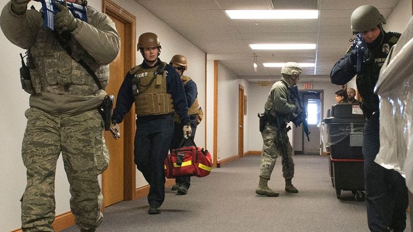 Wright-Patterson Air Force Base Security Forces and emergency-response personnel enter a base facility during a previous active-shooter exercise. Active-shooter response is the focus of a base-wide exercise Feb. 24. U.S. AIR FORCE PHOTO/WESLEY FARNSWORTH
