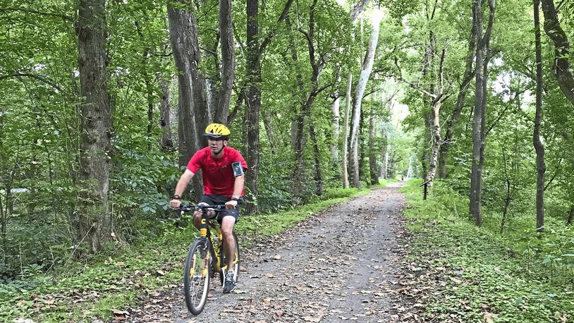 A cyclist rides on the C&O Canal Towpath between Harpers Ferry and Sheperdstown, W. Va. (Virginia Linn/Pittsburgh Post-Gazette/TNS)