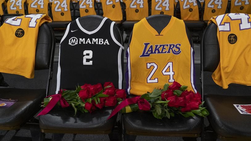 Flowers were placed on courtside seats in honor of Kobe Bryant and his daughter Gianna at the Staples Center in Los Angeles before the Los Angeles Lakers played the Portland Trail Blazers on Jan. 31. PHILIP CHEUNG / THE NEW YORK TIMES
