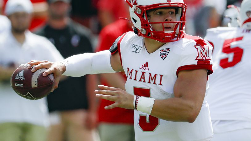 FILE - Miami (Ohio) quarterback Brett Gabbert looks to throw a pass during the first half of an NCAA college football game against Cincinnati in Cincinnati, Sept. 14, 2019. Gabbert is the younger brother of Blaine Gabbert, who is Tom Brady's backup in Tampa Bay and was the 10th overall draft pick by Jacksonville in 2011. The younger Gabbert has thrown for 1,475 yards and 15 touchdowns in the past four games. (AP Photo/John Minchillo, File)