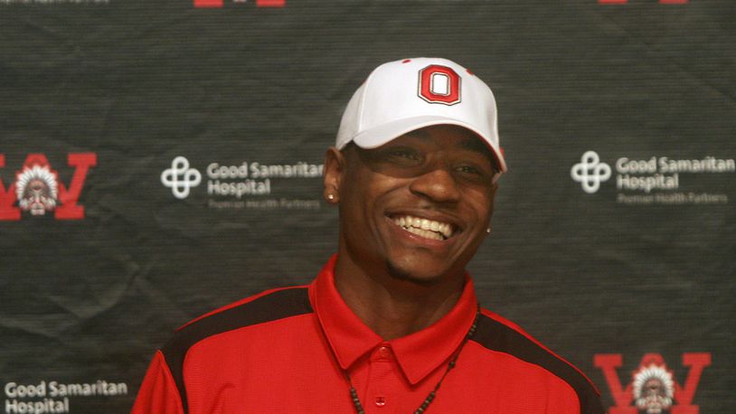 Braxton Miller, Wayne High School’s star quarterback, sports an Ohio State had at a press conference Thursday, June 3. Miller, who just completed his junior year, revealed his intention to join the Ohio State football team after he graduates. Staff photo by Jan Underwood