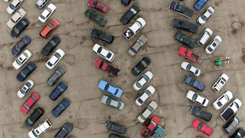 Aerial view of Sandy’s Towing lot in Dayton. The city contracts with Sandy’s for towing vehicles with outstanding tickets. TY GREENLEES / STAFF