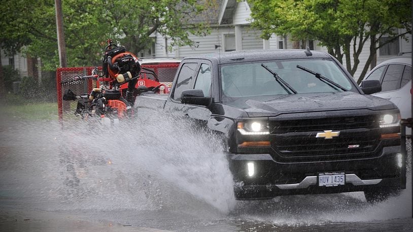 Heavy rainfall on Tuesday, May 4, 2021, caused standing water on roads like on Patterson Road in Dayton. MARSHALL GORBY\STAFF
