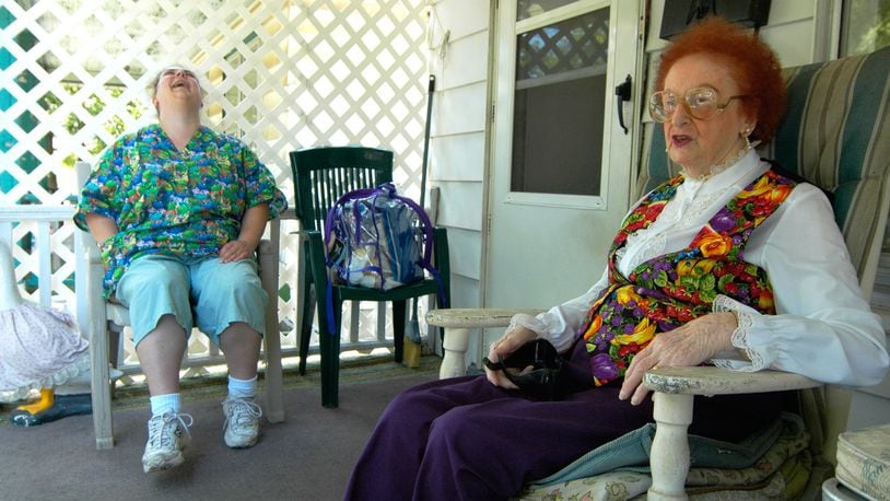 Opal Hatton, 94, jokes with Elizabeth Barnes from Personal Touch Home Care during a in this 2007 file photo to Hatton’s home in Middletown. STAFF FILE PHOTO