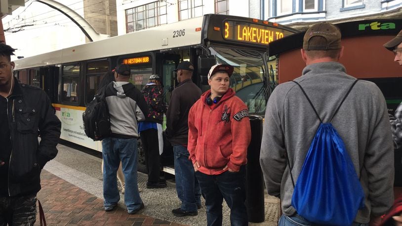 Riders wait at the RTA hub in Downtown Dayton. FILE PHOTO