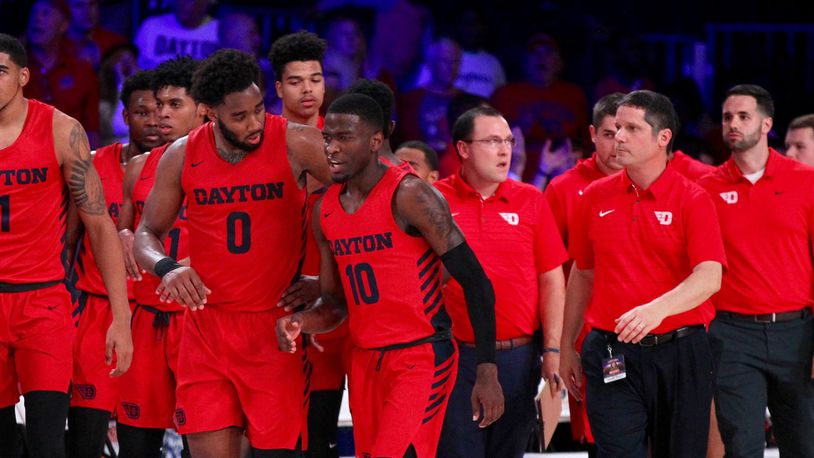 Dayton players, including Josh Cunningham and Jalen Crutcher, leave the court at halftime of a game against Butler in the first round of the Battle 4 Atlantis on Wednesday, Nov. 21, 2018, at Imperial Gym on Paradise Island, Bahamas. David Jablonski/Staff