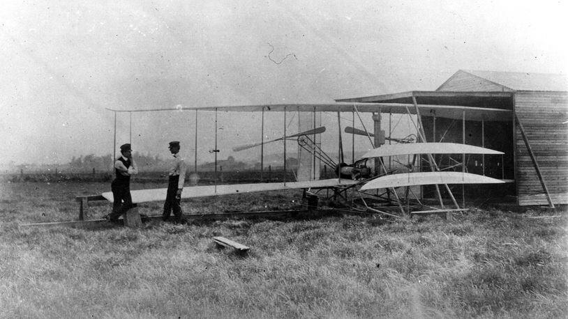 Orville, left, and Wilbur Wright at their hanger at Huffman Prairie in 1904.