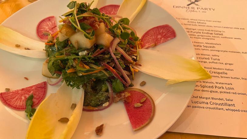 Chef Adrian Madrigal of Loose Ends Brewing Co. prepared this pear and purple endive salad for a Dayton Chefs United fundraiser.  ALEXIS LARSEN/CONTRIBUTOR