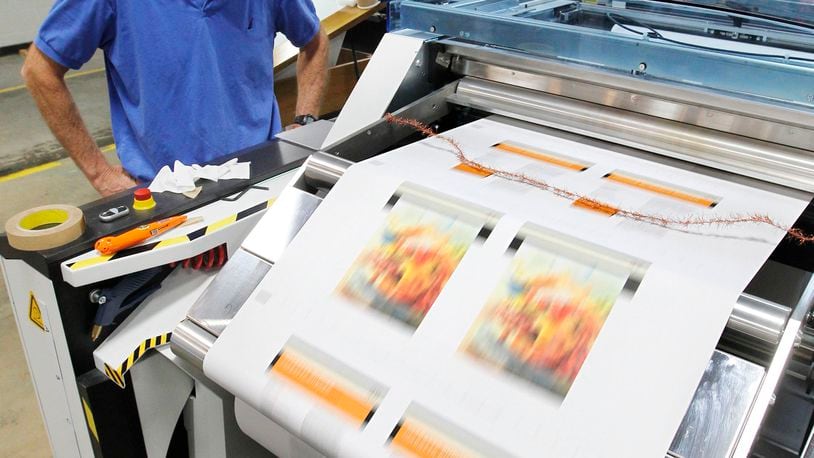 Kodak senior systems analyst John Hickey in this file photo watches a press run test on a Kodak Prosper 5000 XLI digital printer at the plant in Kettering.