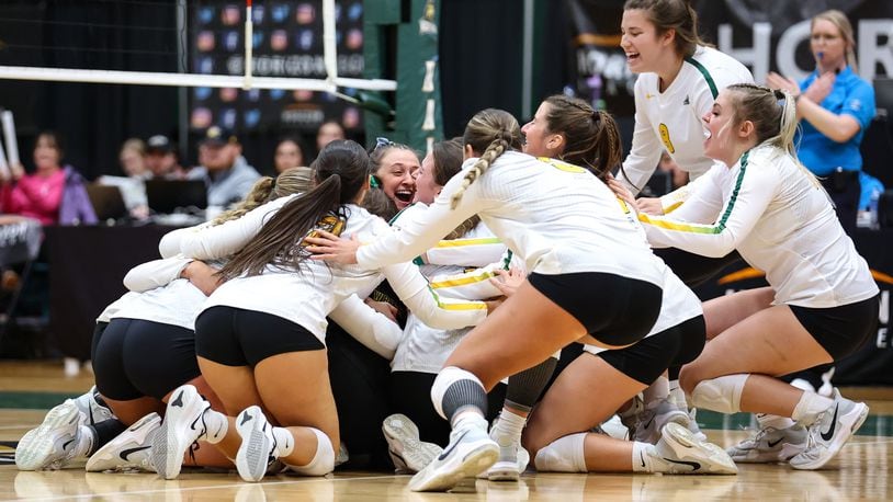 The Wright State volleyball team celebrates after beatin Northern Kentucky in the Horizon League championship match Sunday at McLin Gymnasium. Austyn McFadden/Wright State Athletics photo