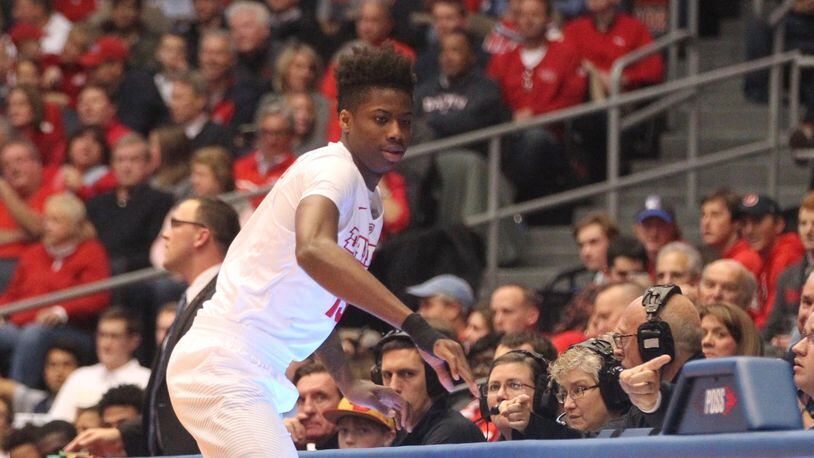 Dayton’s Kostas Antetokounmpo checks into a college game for the first time during the season opener against Ball State on Friday, Nov. 10, 2017, at UD Arena. David Jablonski/Staff