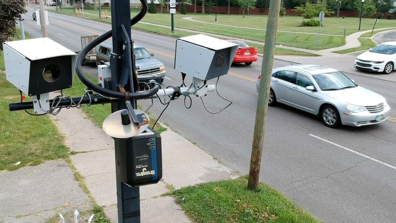 City of Dayton portable speed cameras on North Main Street near Forest Glen Avenue. The city won a preliminary injunction against the State of Ohio that prevents the state from withholding local government funds as punishment for its traffic cameras. TY GREENLEES / STAFF