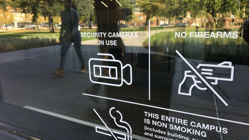A sign at one of the entranceways of the new main Dayton Metro Library downtown notifies visitors that guns are not permitted. CORNELIUS FROLIK / STAFF