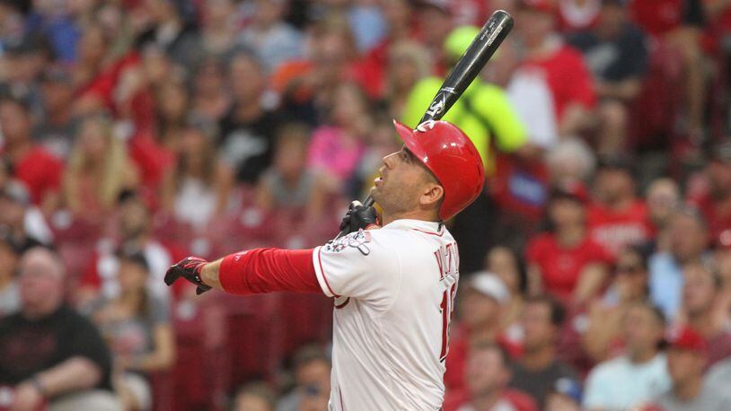 The Reds’ Joey Votto hits a grand slam against the Tigers on Tuesday, June 19, 2018, at Great American Ball Park in Cincinnati. David Jablonski/Staff