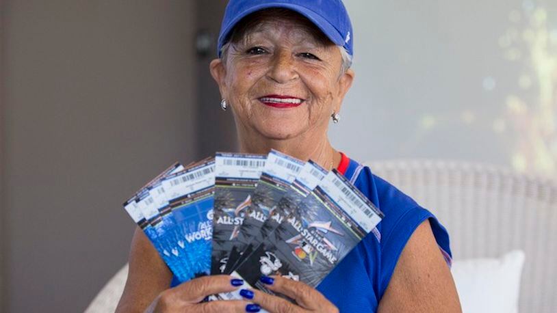 Jean Marie Tidbit Carrino, 62, holds her tickets to the 88th Major League Baseball All-Star Game taking place at Marlins Parks on July 11, 2017. Carrino, a Cubs fanatic, will now have attended 54 consecutive MLB All-Star Games since the age of 8. (Matias J. Ocner/Miami Herald/TNS)