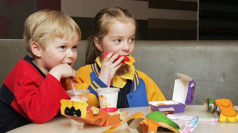 MELBOURNE, AUSTRALIA - AUGUST 29: Children eat a new Happy Meal at the McDonald's restaurant in Collingwood on August 29, 2006 in Melbourne, Australia. The new Happy Meal is a low fat alternative to the fast food chain's traditional Happy Meal. Childhood obesity is a major health issue in Australia and has tripled in the last 20 years with one in six Australian children classed as obese. (Photo by Kristian Dowling/Getty Images)