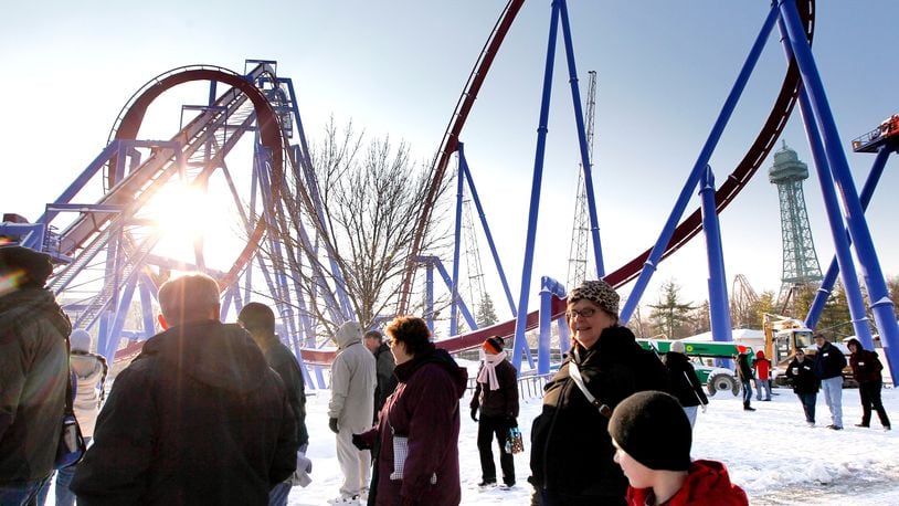 Members of the American Coaster Enthusiasts group get an close-up look at the new Banshee roller coaster being built at Kings Island during a visit to the park Saturday, Dec. 7, 2013. NICK DAGGY / STAFF
