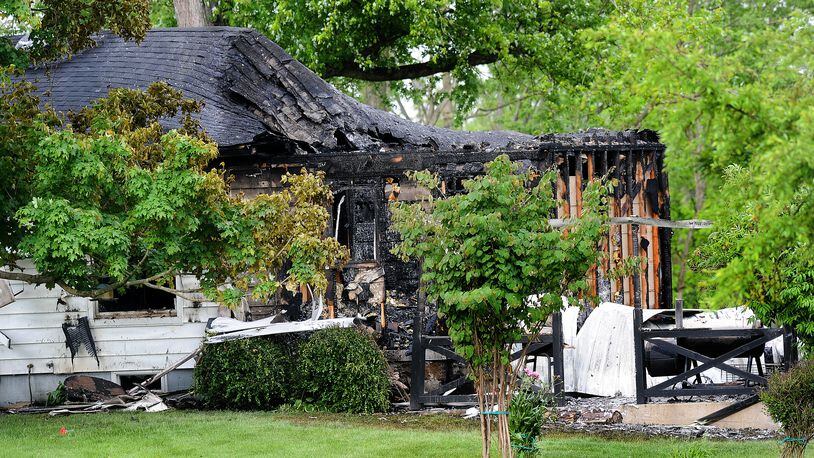 One person is dead and another was taken to the hospital after a house fire on Denlinger Road in Trotwood early Monday morning, May 23, 2022. MARSHALL GORBY\STAFF

