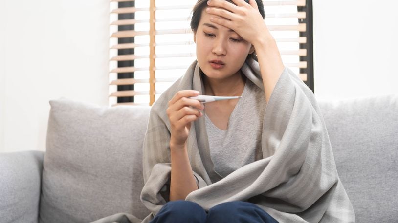 Seasonal influenza, like COVID-19, is a contagious respiratory illness that disproportionately affects adults ages 65 and older. KMPZZZ/SHUTTERSTOCK