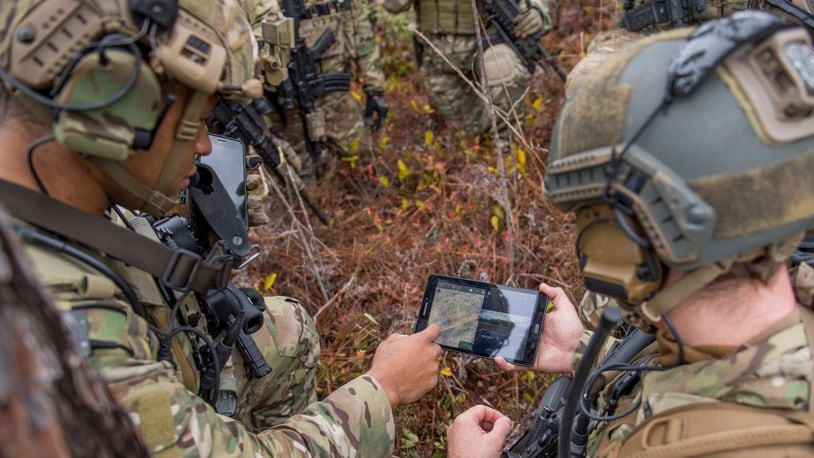 Members of the 6th Special Operations Squadron use a tablet to upload coordinates during an exercise showcasing the capabilities of the Advanced Battle Management System at Duke Field, Fla., Dec. 17, 2019. During the first demonstration of the ABMS, operators across the Air Force, Army, Navy and industry tested multiple real-time data sharing tools and technology in a homeland defense-based scenario enacted by U.S. Northern Command and enabled by Air Force senior leaders. The collection of networked systems and immediately available information is critical to enabling joint service operations across all domains. (U.S. Air Force photo by Tech. Sgt. Joshua J. Garcia)