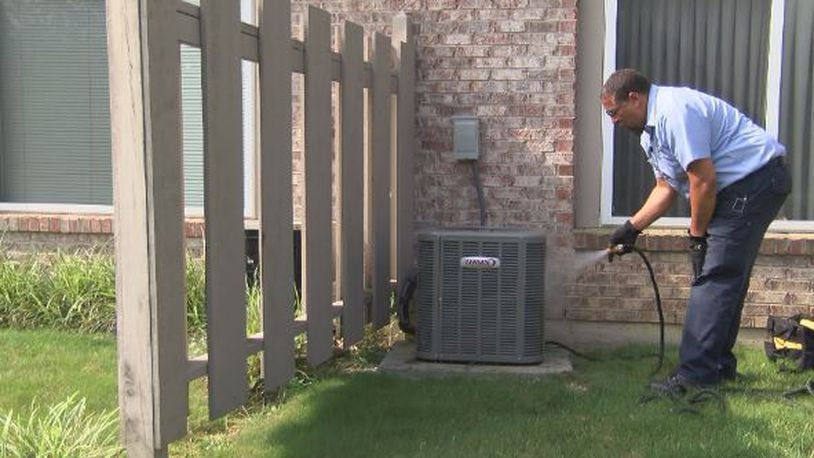George Rodriguez with Stevenson Service Experts performs a routine HVAC inspection and cleaning.