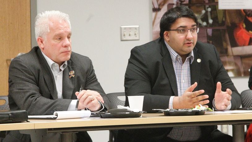Ohio state representatives Phil Plummer (left), R-Dayton, and Niraj Antani, R-Miamisburg, attend a meeting Friday with Montgomery County commissioners and representatives of the County Commissioners Association of Ohio. CHRIS STEWART / STAFF