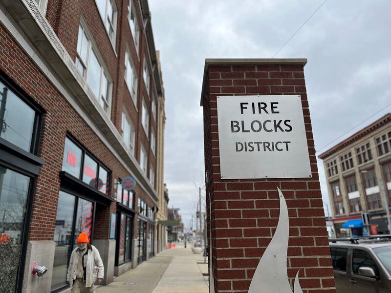 A man walks through the Fire Blocks District on East Third Street in downtown Dayton. Multiple buildings have been rehabbed in the district with the help of state historic preservation tax credits. CORNELIUS FROLIK / STAFF