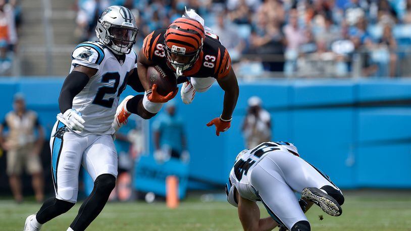 Tyler Boyd #83 of the Cincinnati Bengals runs the ball against James Bradberry #24 of the Carolina Panthers in the first quarter during their game at Bank of America Stadium on September 23, 2018 in Charlotte, North Carolina. (Photo by Grant Halverson/Getty Images)