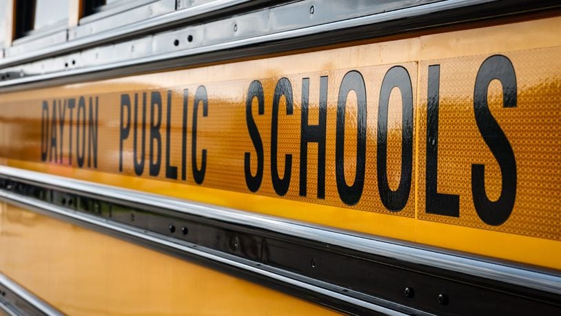 A Dayton Public School bus sits in the bus lot on James H. McGee Blvd. in Dayton. JIM NOELKER/STAFF