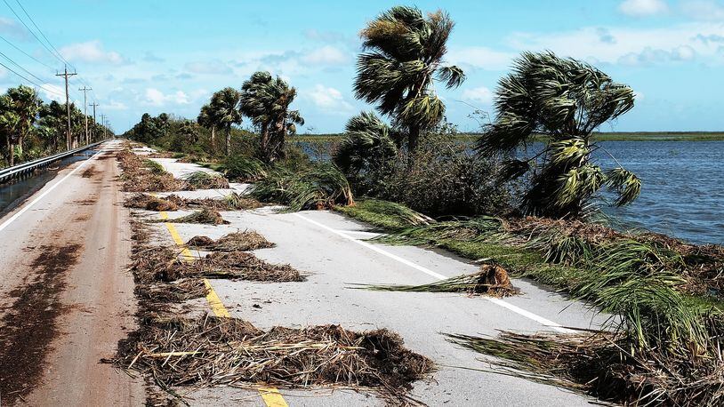 NAPLES, FL - SEPTEMBER 11: A road with heavy debris stands on the outskirts of a rural part of Naples the day after Hurricane Irma swept through the area on September 11, 2017 in Naples, Florida. Hurricane Irma made another landfall near Naples yesterday after inundating the Florida Keys. Electricity was out in much of the region with extensive flooding. (Photo by Spencer Platt/Getty Images)