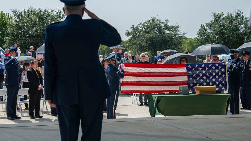 Air Force Honor Guard members fold the U.S. flag during the interment of retired Col. Richard E. Cole Sept. 7 at the Fort Sam Houston National Cemetery. Cole’s decorations include the Distinguished Flying Cross with two oak leaf clusters, Air Medal with one oak leaf cluster, Bronze Star Medal, Air Force Commendation Medal, and Chinese Army, Navy Air Corps Medal, Class A, First Grade. All Doolittle Raiders were awarded the Congressional Gold Medal in May 2014. U.S. AIR FORCE PHOTO