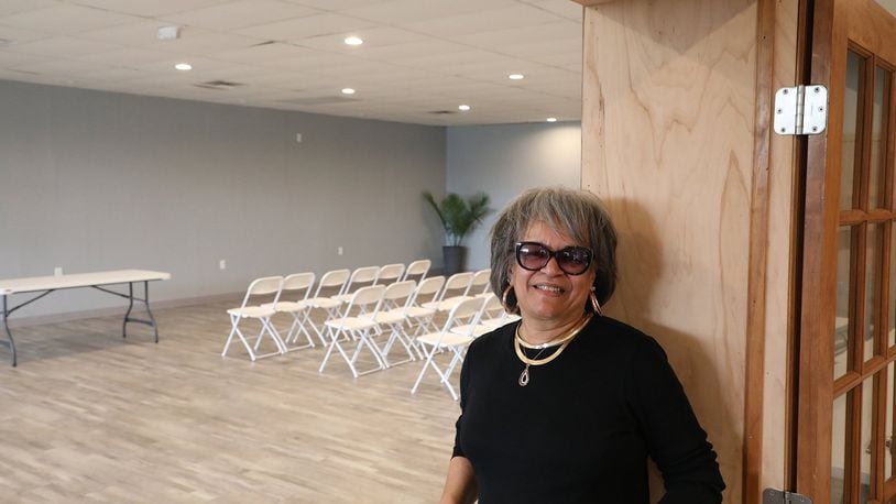 Sheila Lash Rice shows off one of the rooms in “The L”, a small banquet facility on South Yellow Springs Street. She will be discussing the past and present of that street during a Thursday night discussion at the Shouvlin Center at Wittenberg University. BILL LACKEY/STAFF