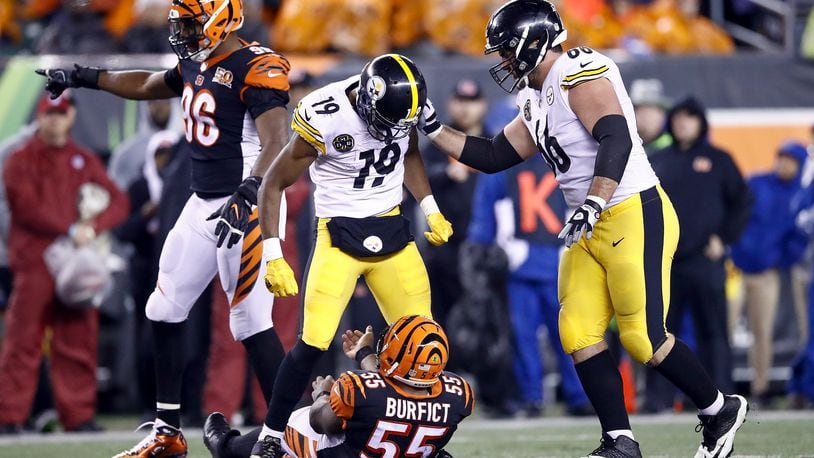 CINCINNATI, OH - DECEMBER 04: JuJu Smith-Schuster #19 of the Pittsburgh Steelers stands over Vontaze Burfict #55 of the Cincinnati Bengals after a hit during the second half at Paul Brown Stadium on December 4, 2017 in Cincinnati, Ohio. (Photo by Andy Lyons/Getty Images)